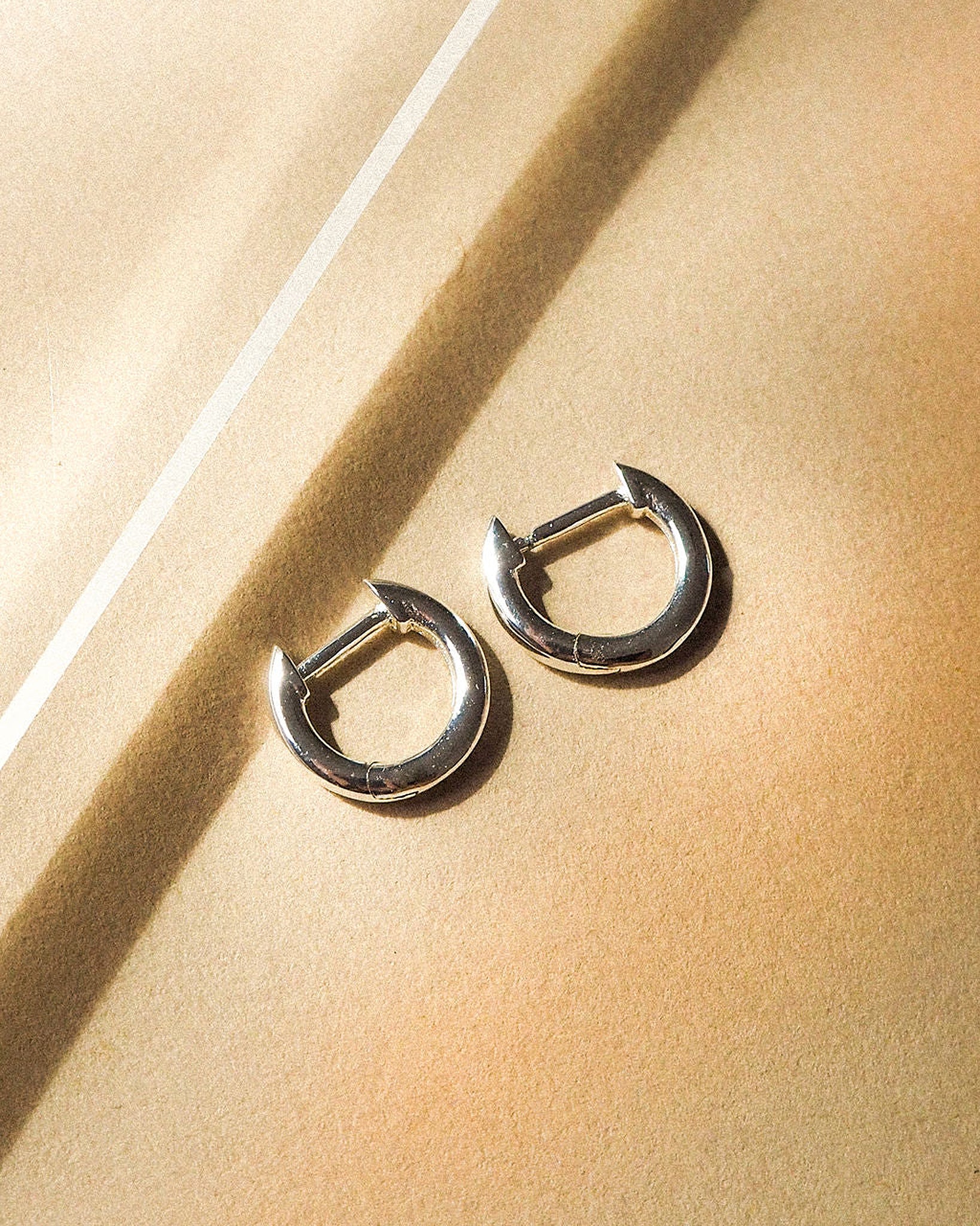 Luv Aj Sicily Tube Huggie Hoop Earrings in Polished Rhodium Silver Plated