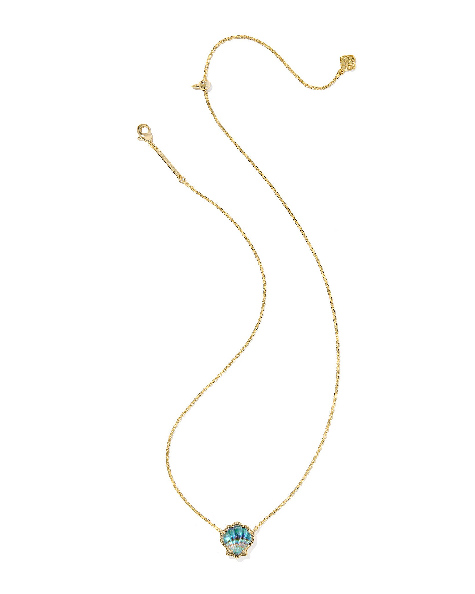 Gold necklace with a seashell pendant on a white background