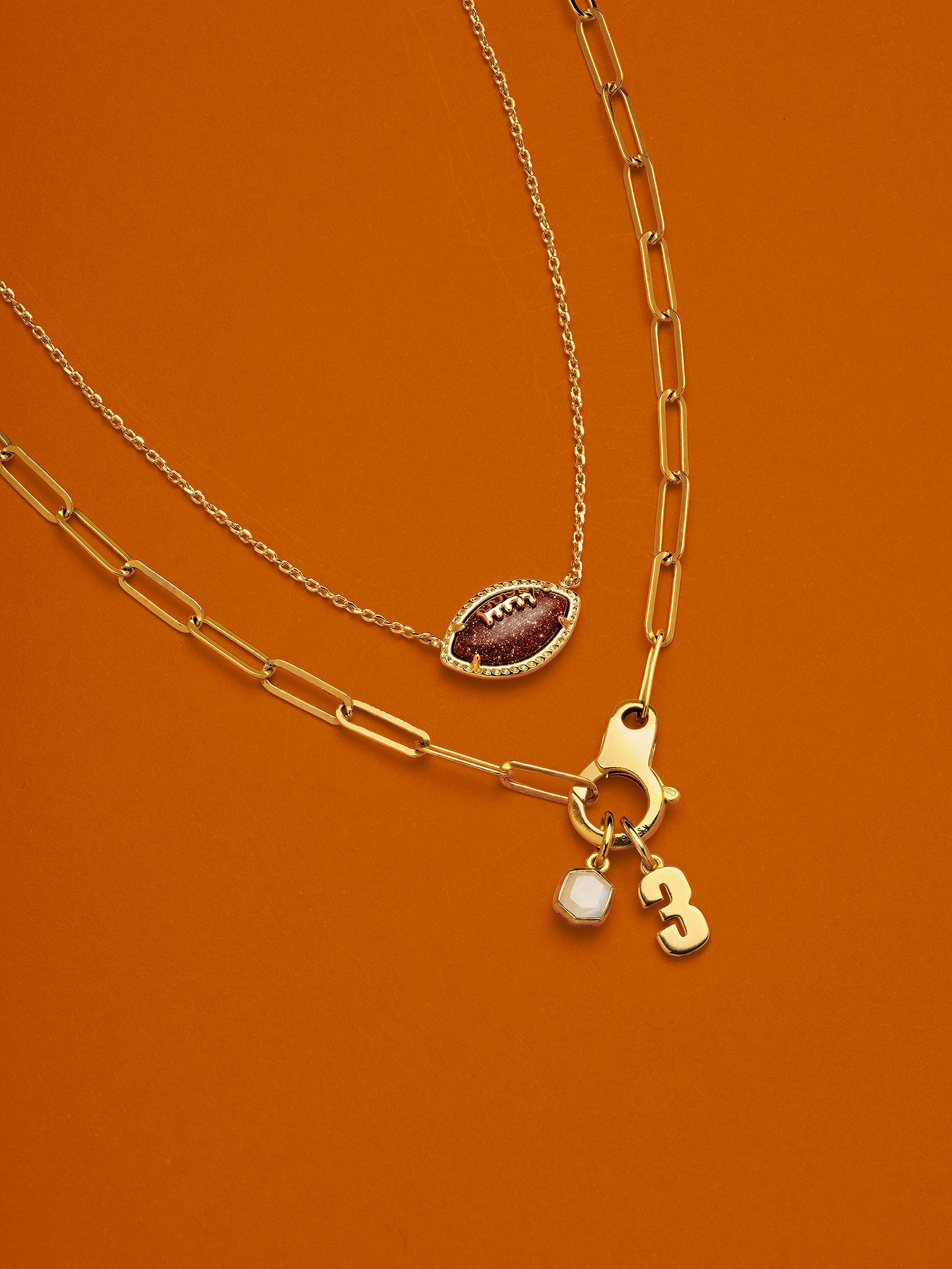 Kendra Scott Football Pendant Necklace in Orange Goldstone and Gold Plated