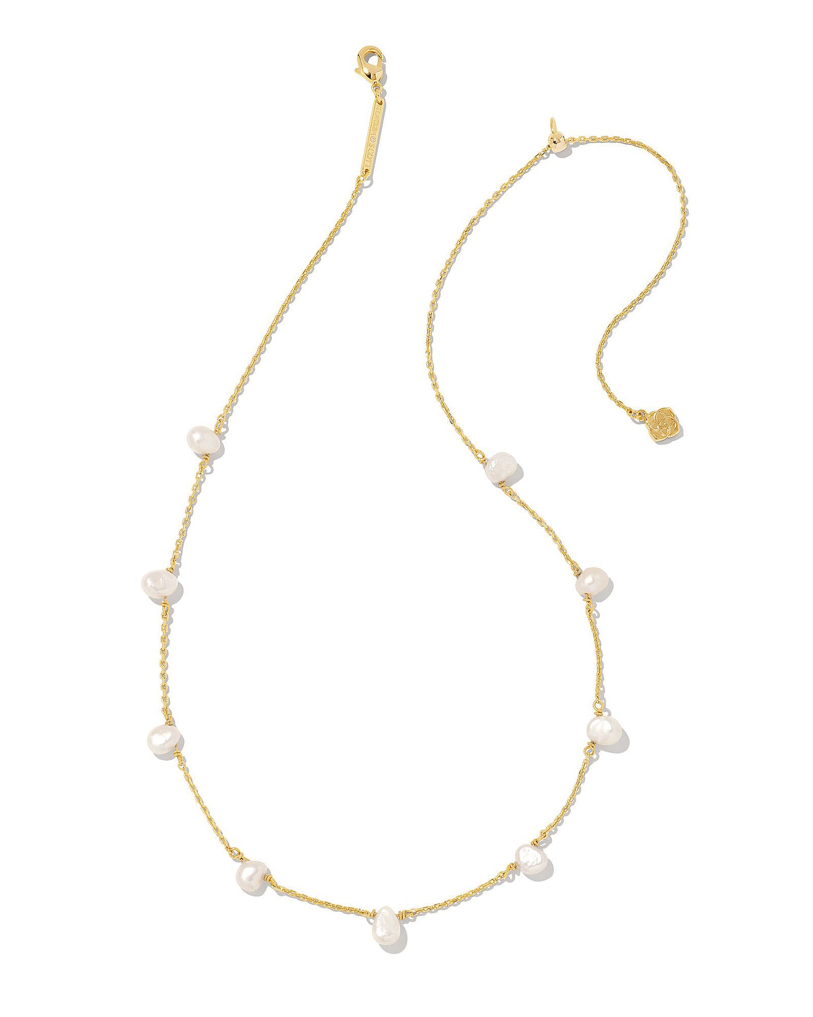 Gold necklace with white pearls on a white background