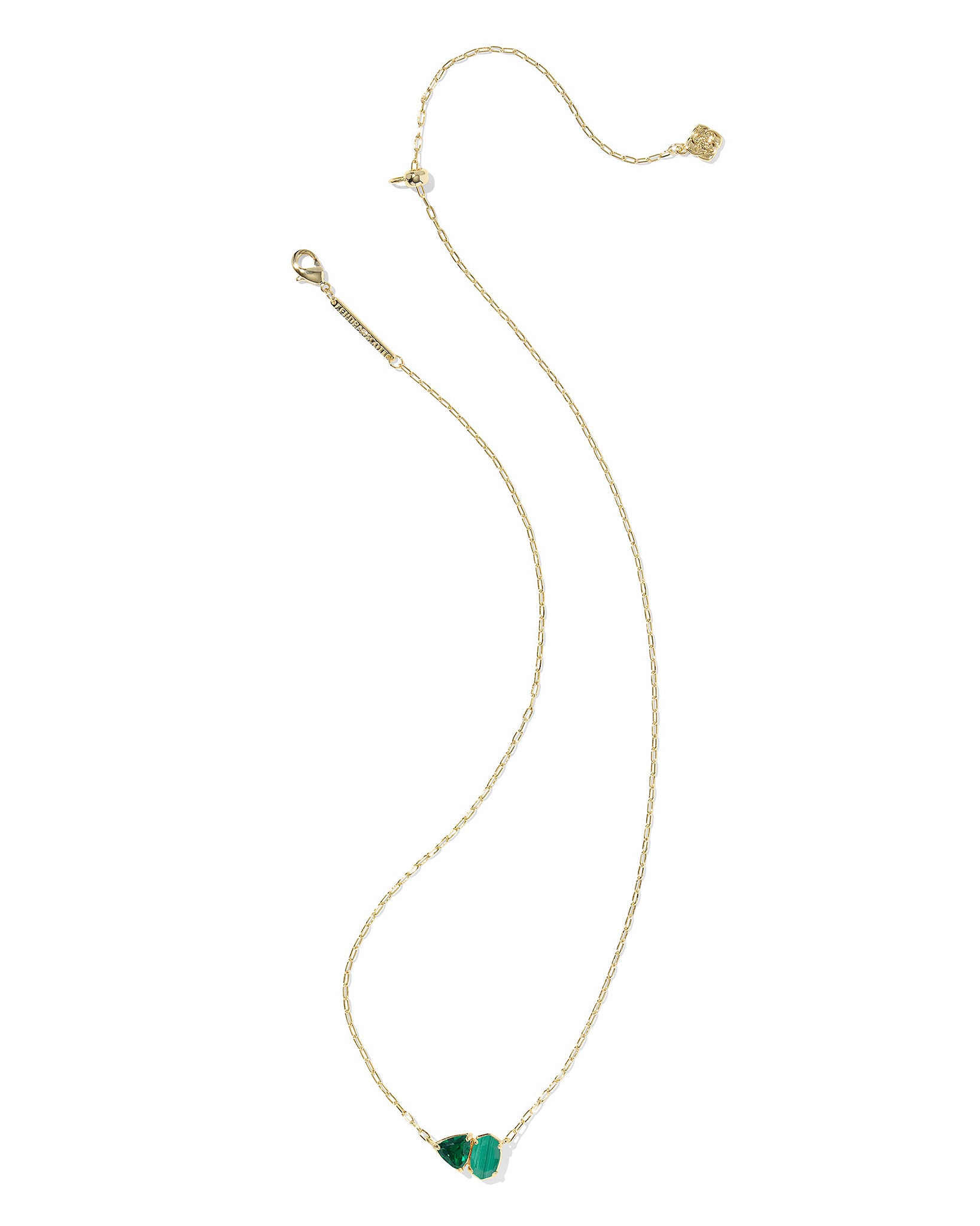 Gold necklace with green geometric pendant on a white background