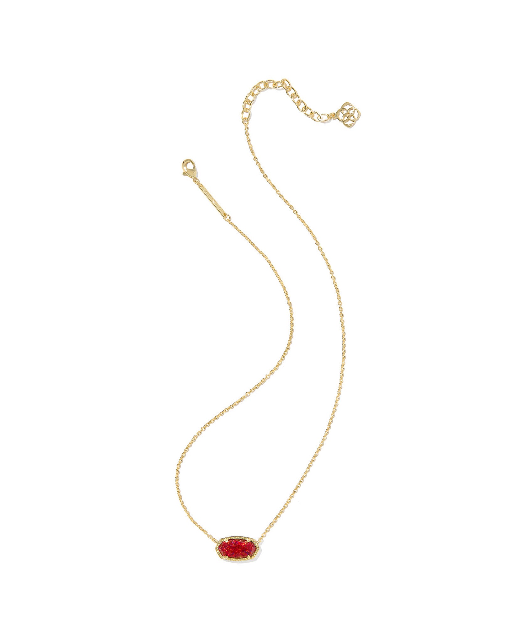 Gold necklace with an oval red pendant on a white background