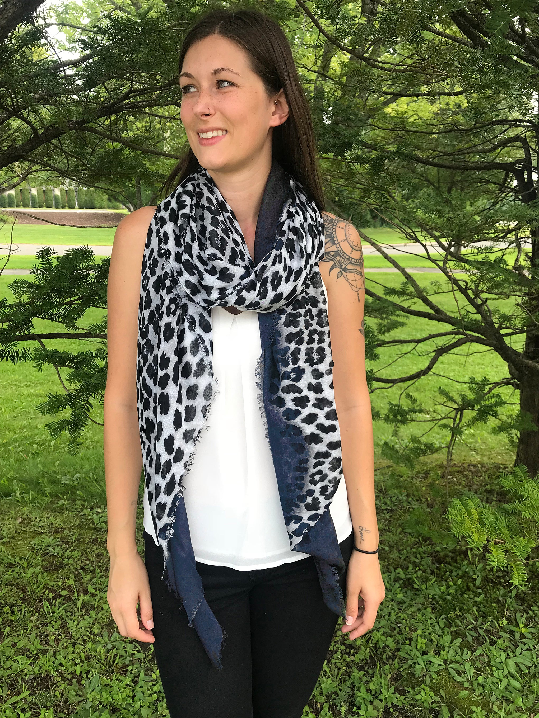 Model Wearing Blue Pacific Animal Print Cashmere and Silk Scarf in Dark Navy Blue and Snow Grey