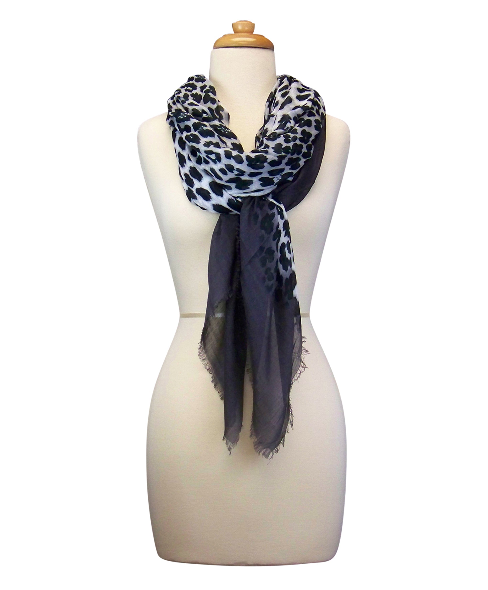 Mannequin Wearing Blue Pacific Animal Print Cashmere and Silk Scarf in Grey Slate and White