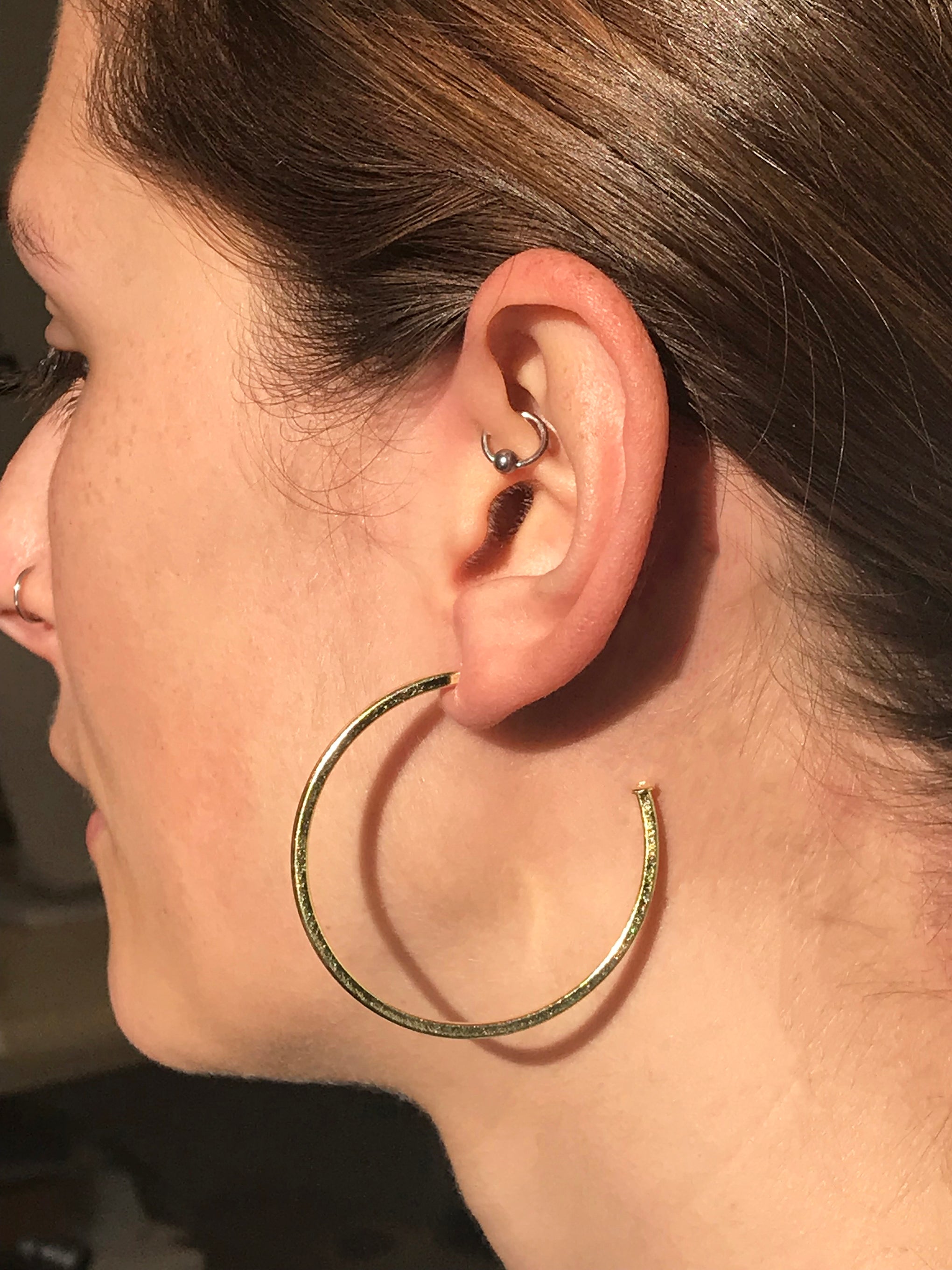 model wearing Sheila Fajl Perfect Hoop Earrings in Gold